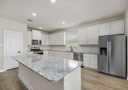 Chef ready kitchen with white cabinets and stainless steel appliances