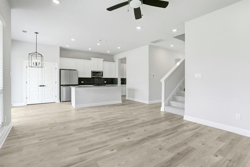 Spacious living area, connected to a breakfast nook and upgraded kitchen.