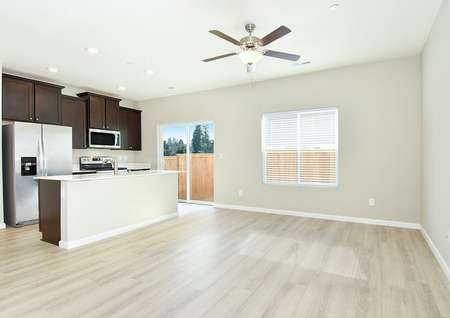 Photo of the open kitchen and family room of the Amethyst townhome by LGI Homes.