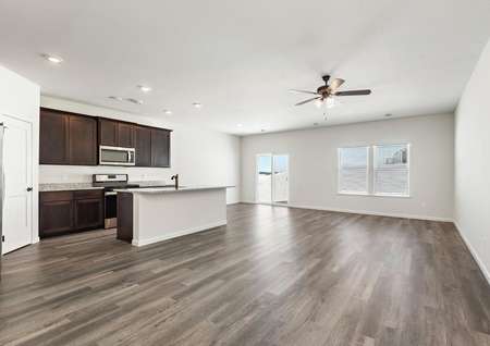 The open concept entertainment space includes the kitchen, dining, and family room