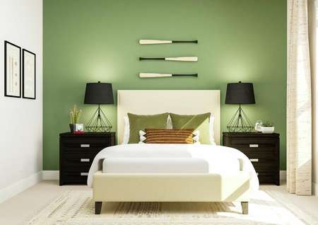 Rendering of a bedroom focusing on a
  large bed surrounded by two nightstands and table lamps. A cream colored rug
  sits atop light carpet, juxtaposed against the green accent wall.