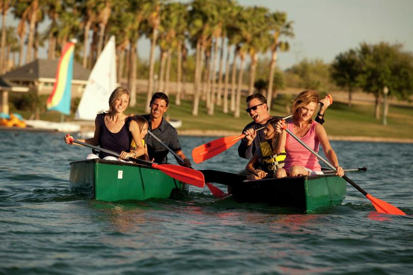 Boating lake with people in canoes in the Estrella community