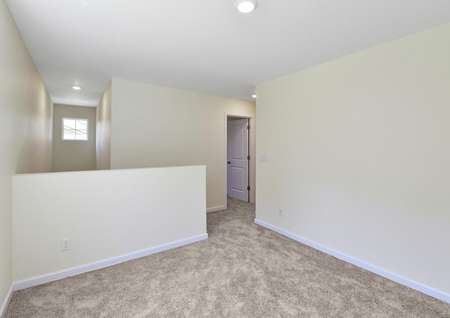 Upstairs game room with carpet