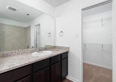 Find stunning finishes in the master bathroom, along with a walk-in closet.