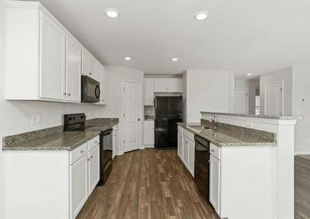 Hartford finished kitchen with wood tile flooring, granite countertops, and white-finished cabinets