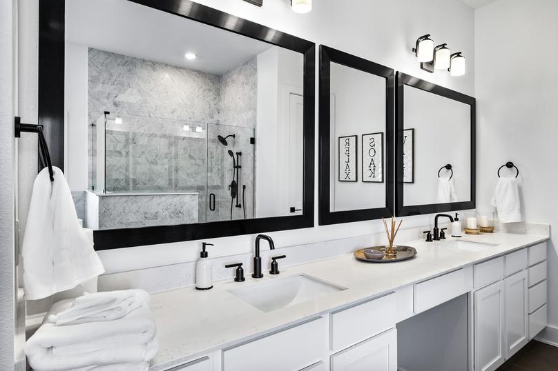 Beautiful master bathroom with large mirrors and a double-sink vanity.
