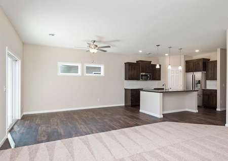 Photo of spacious and open family room, dining room and kitchen.