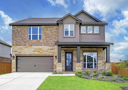 Exterior of the Brazos with a covered front porch, stunning stone and brick, and a two-car garage.