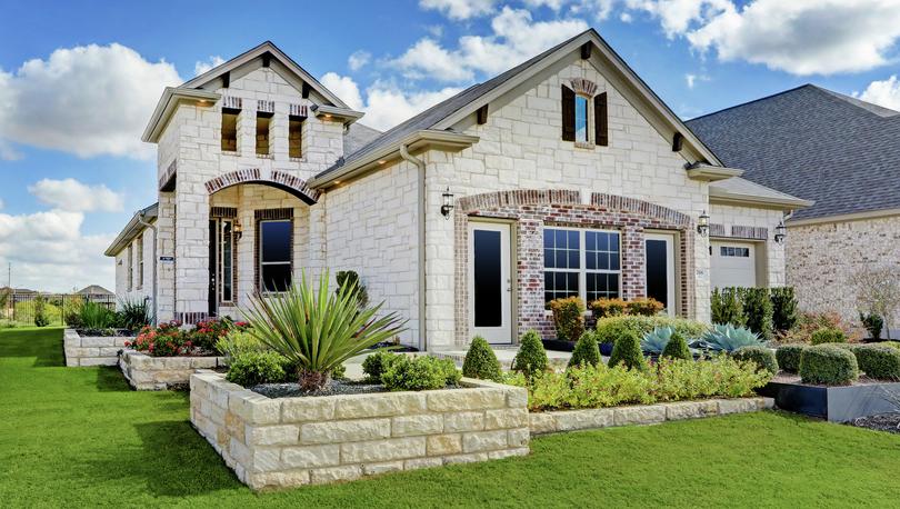 The Timberlake is a beautiful home with a stunning stone exterior.