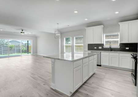 Open-concept layout, featuring a chef-ready kitchen, dining area, and spacious living room.