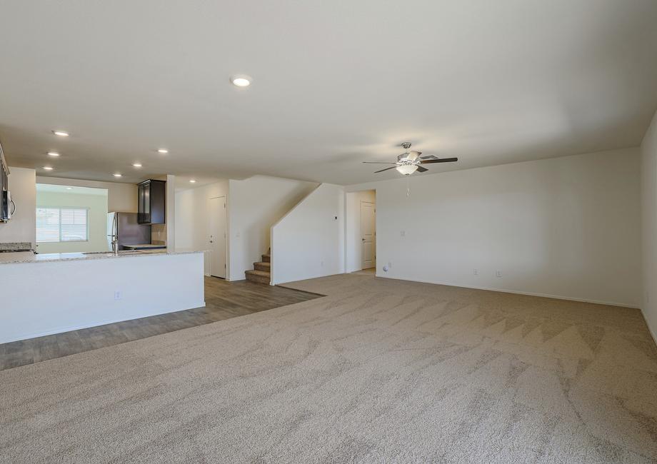 Extra spacious family room, giving you all the room you need to lounge comfortably, with access to the kitchen.