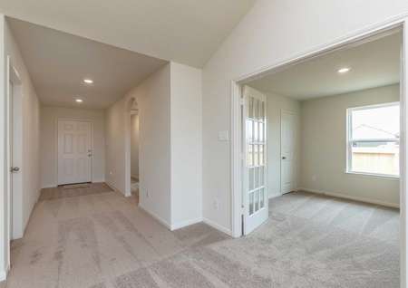 Sabine new home plan with carpeted floors, French doors, and white trim on off-white walls