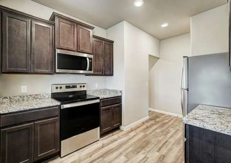 The chef-ready kitchen comes with all new stainless steel appliances.
