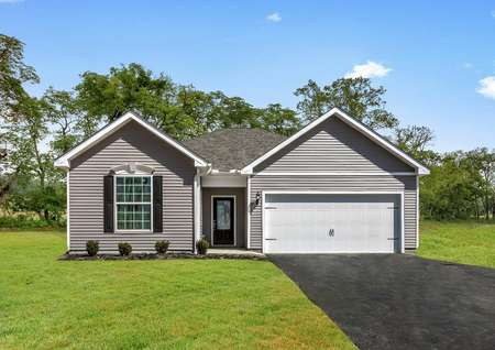 Front exterior photo of the Martin plan by LGI Homes with gray paint, white trim, black shutters, oversized lot.