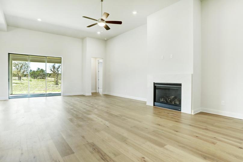 The Garza offers soaring ceilings and a fireplace in the family room.