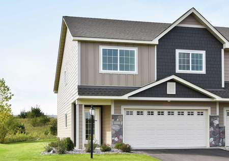 Photo of the front elevation of the Blackberry townhome duplex at Riverpointe by LGI Homes in Watertown, MN.