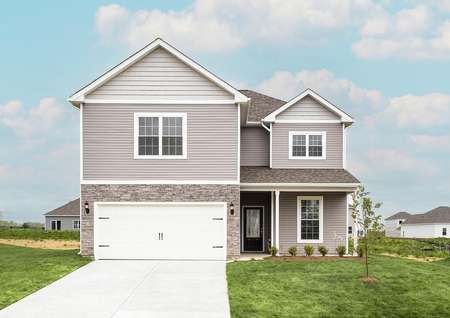 Front elevation of the Waverly plan by LGI Homes with light gray siding with white trim and gray stone accents.