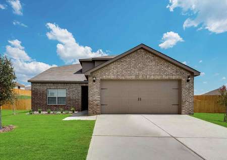 Cypress brick-finished house exterior with concrete driveway, two-car garage, and single story