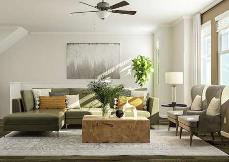 Rendering of the living room furnished
  with a sectional, two armchairs and a coffee table. The space has several
  windows, vinyl plank wood flooring and the staircase is visible in the
  background.