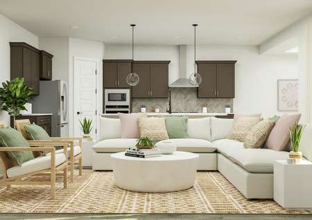 Rendering of the open living space of the
  McAlester floor plan featuring a large white sectional, two accent chairs,
  short table, and décor with a view of the kitchen in the background. 