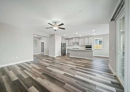 Open-concept layout with the upgraded kitchen overlooking the large family room. 