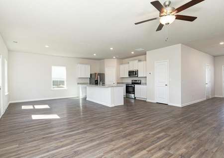 The entertainment space is open and includes the kitchen, family room, and dining room
