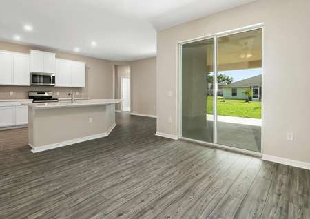 Open-concept family room, chef-ready kitchen and covered back patio. 