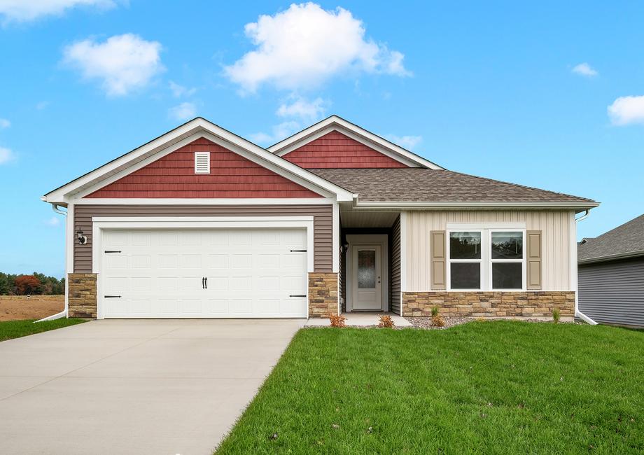 Beautiful single story home with brick and plank siding.
