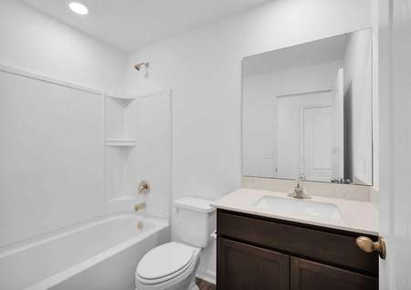 A full bathroom that is centrally located in the home. 