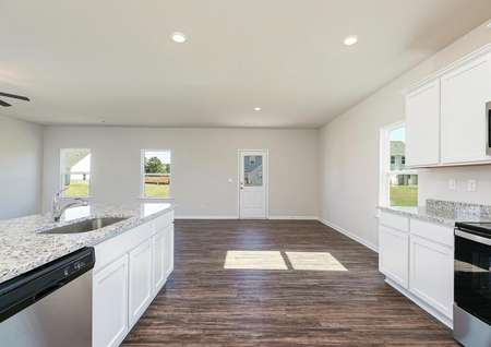 The kitchen leads straight into the dining area, making hosting a breeze