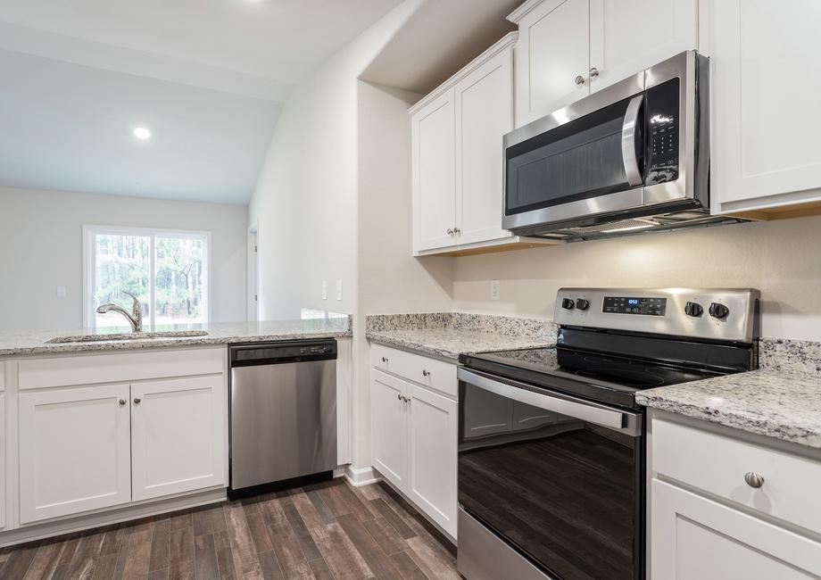The kitchen features stainless steel appliances.