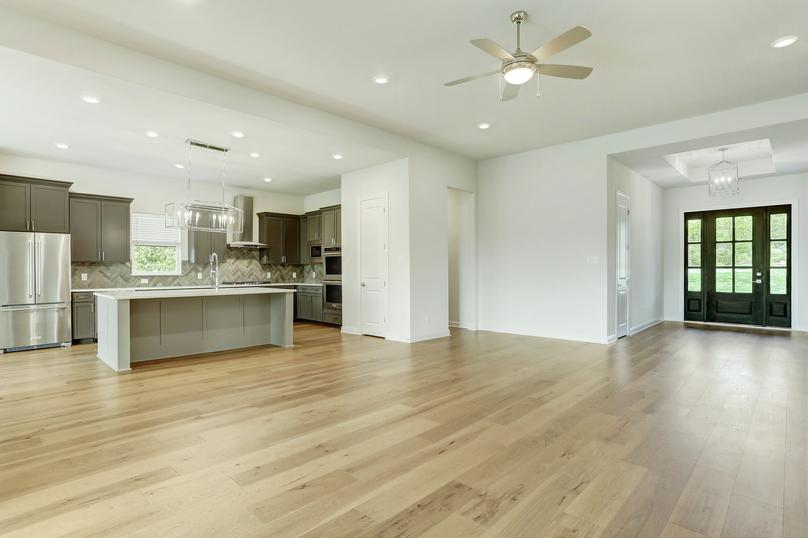 This home has an incredible open layout, white walls and wood flooring.