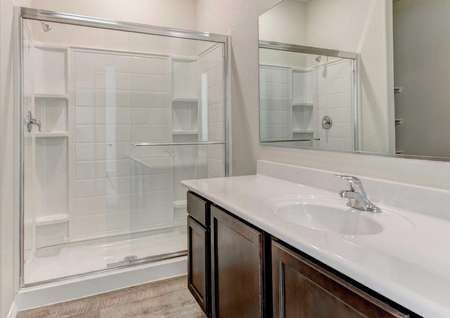 Bisbee bathroom with white countertop and walk-in shower unit