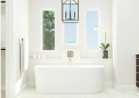 Rendering showcasing the freestanding
  bathtub complemented by three windows, beautiful chandelier and flower within
  a vase. A double vanity and walk-in closet can be seen to either side.