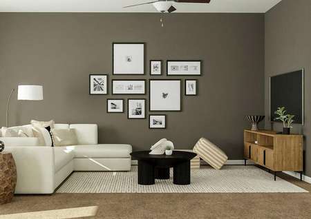 Rendering of living room with couch,
  round coffee table, storage space and tv above storage.