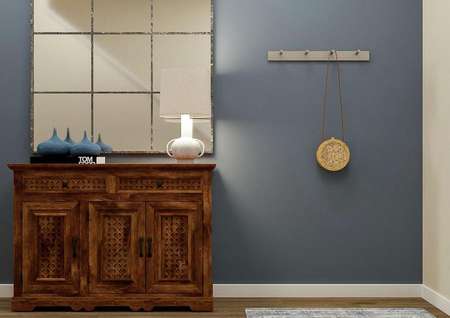 Rendering of the
  entry hall focused on the blue accent wall, wooden console table and large
  mirror.