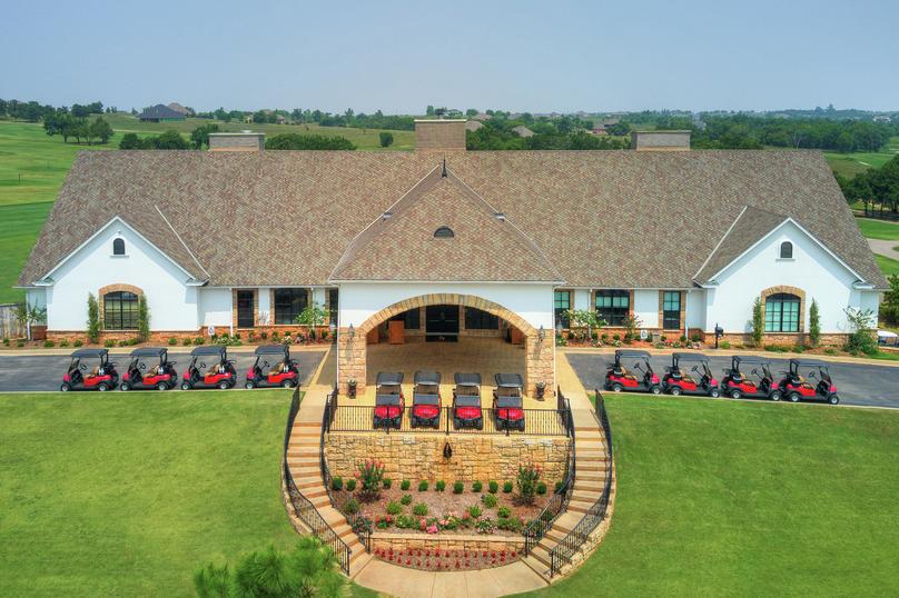 Winter Creek Clubhouse with red golf carts neatly parked.