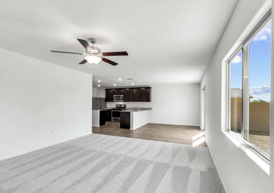 Open-concept layout with a spacious family room, dining area, and kitchen.