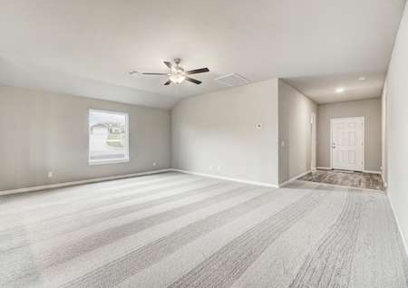Wide family room with more than enough room for entertaining family and friends. 