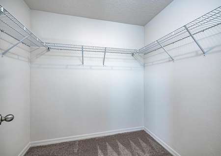 The master bedroom features its own walk-in closet with plenty of storage space. 