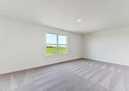 Travis loft space with large window, ceiling light and carpet. 