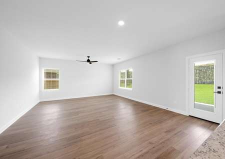 Spacious family room with plank flooring