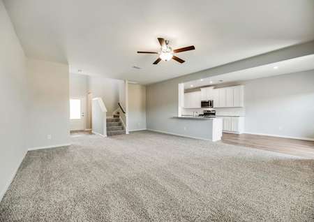 The open family room offers great natural light and a ceiling fan.