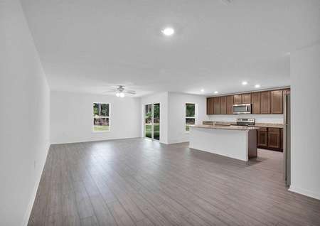 The family room stretching from the outdoor entertainment space to the chef-ready kitchen.