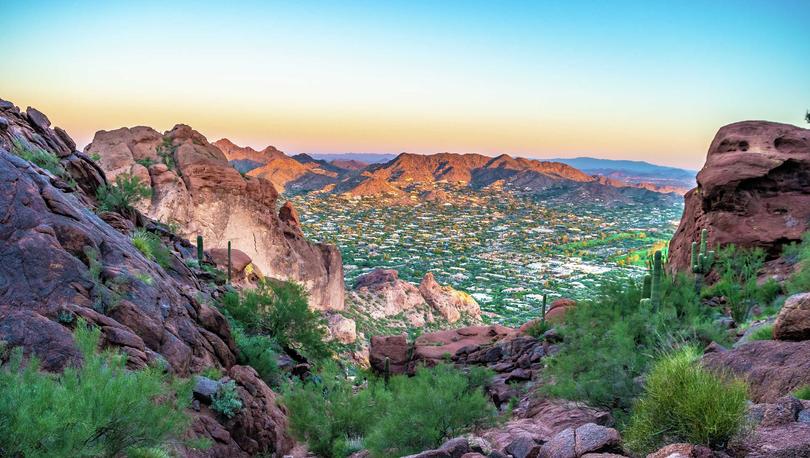 Phoenix, Arizona Camelback Mountain from the top looking down on numerous desert plants, cacti, and multi-colored rocks