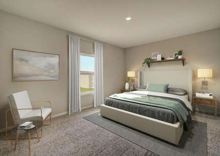 Staged master suite with tan bed and white chair in the corner.