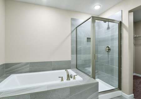 Master bathroom with soaking tub and step-in shower