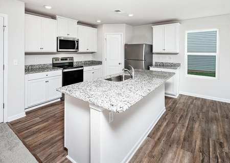 Chef-ready kitchen with stainless steel appliances, granite countertops and white cabinets.