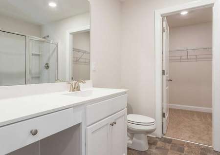 Avery master bath with large vanity, walk-in closet, and white cabinetry