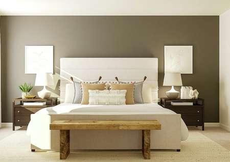 Rendering of the spacious master bedroom
  with a large cream-colored bed and two nightstands against a dark gray accent
  wall. On the left a window with white curtains and on the right is the
  entrance to the attached bath. 